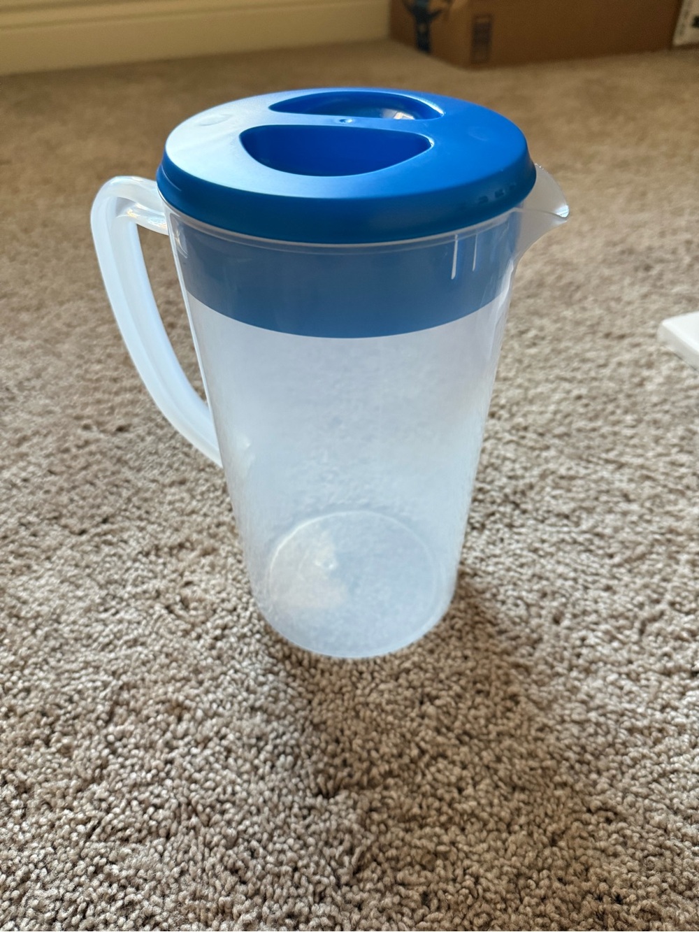 Plastic Beverage Pitcher with Blue Lid and Handle